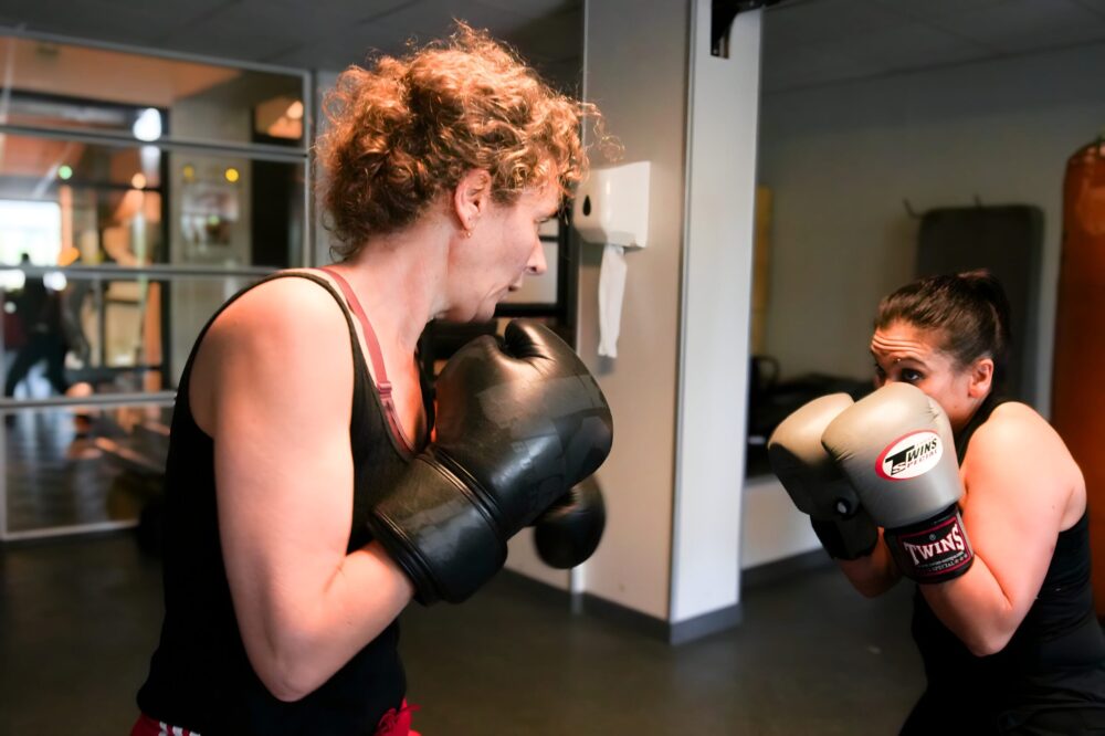 Wimen sparring during boxing class